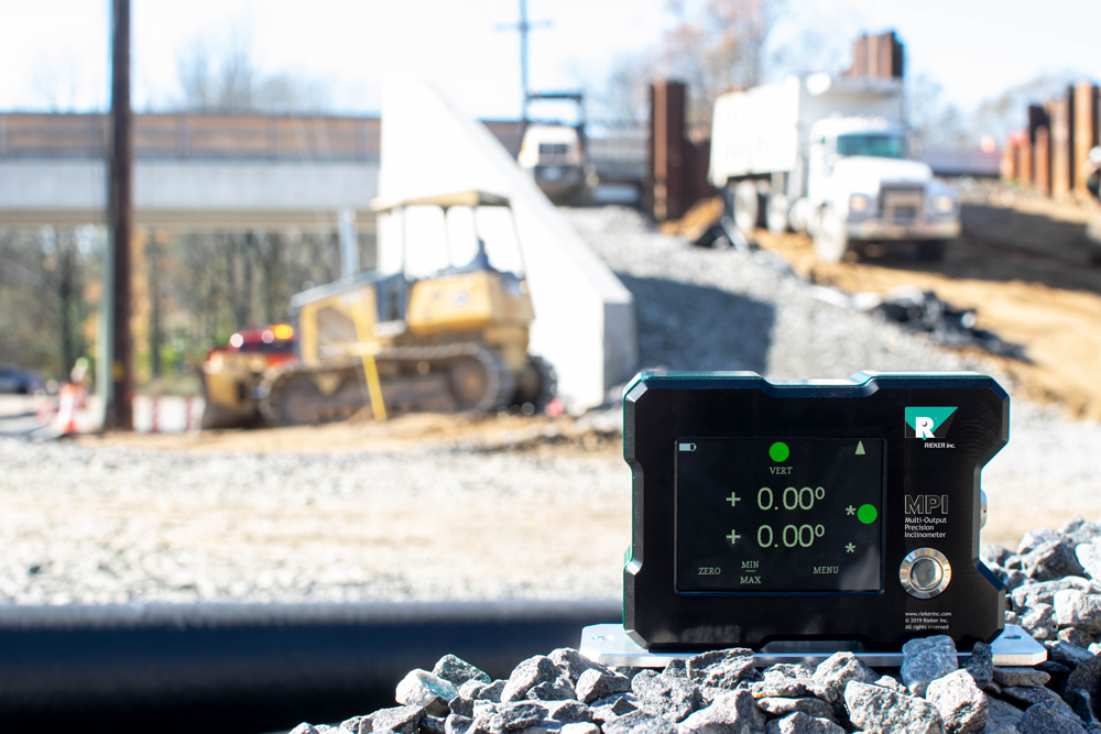 This is an image of our MPI unit displayed at a construction site with construction equipment in the background.