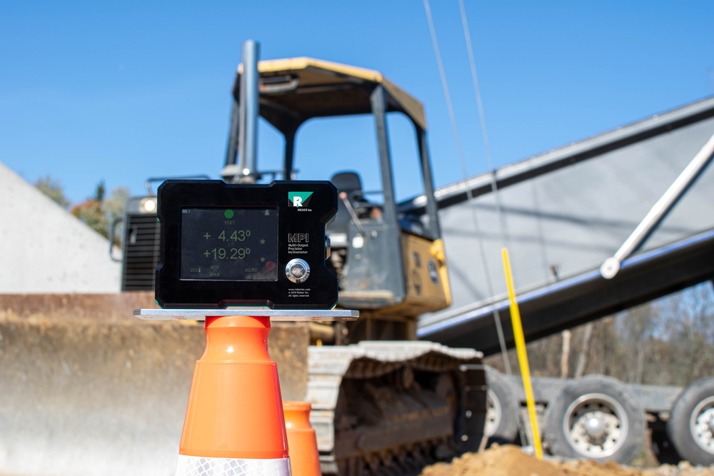 This is an image of our MPI unit displayed in front of construction equipment at a job site.